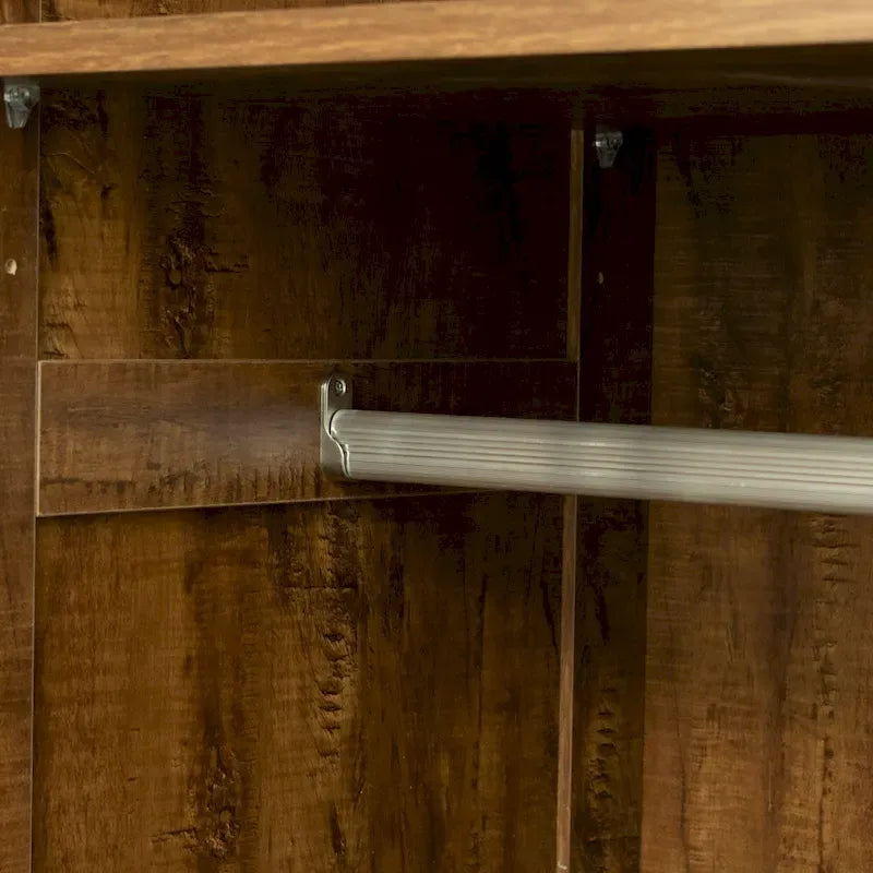 Armoire-penderie en bois blanc avec portes, tiroirs et tringle.