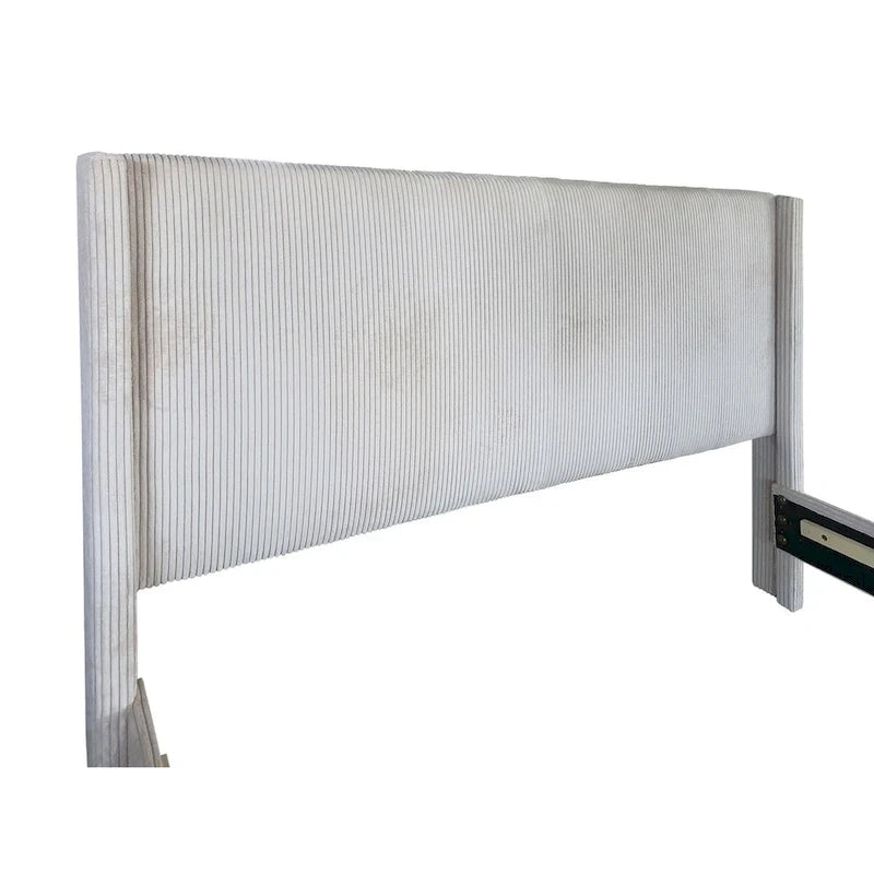 Lit capitonné à oreilles avec tiroir de rangement au pied du lit