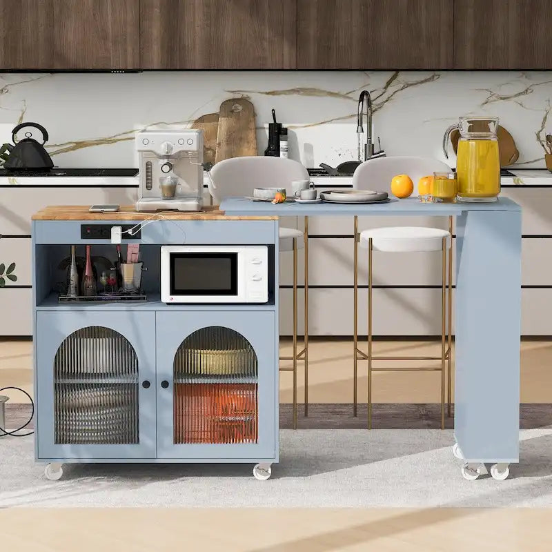 Desserte de cuisine en bois d'hévéa avec abattant, table extensible, 2 portes vitrées cannelées, éclairage LED et prise électrique.