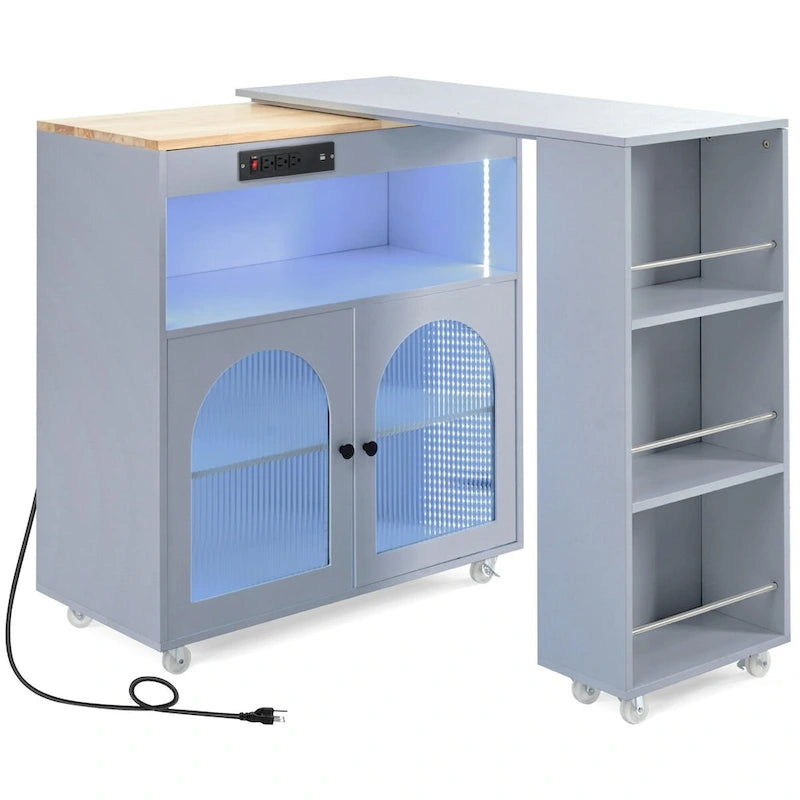 Desserte de cuisine en bois d'hévéa avec abattant, table extensible, 2 portes vitrées cannelées, éclairage LED et prise électrique.